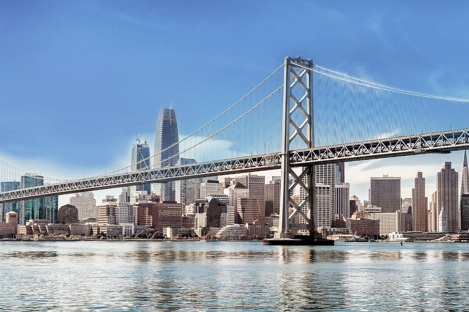 Bridge over waters against city line Bridge over waters against city line